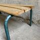 Vintage wood kindergarten bench and tubular structure in long
