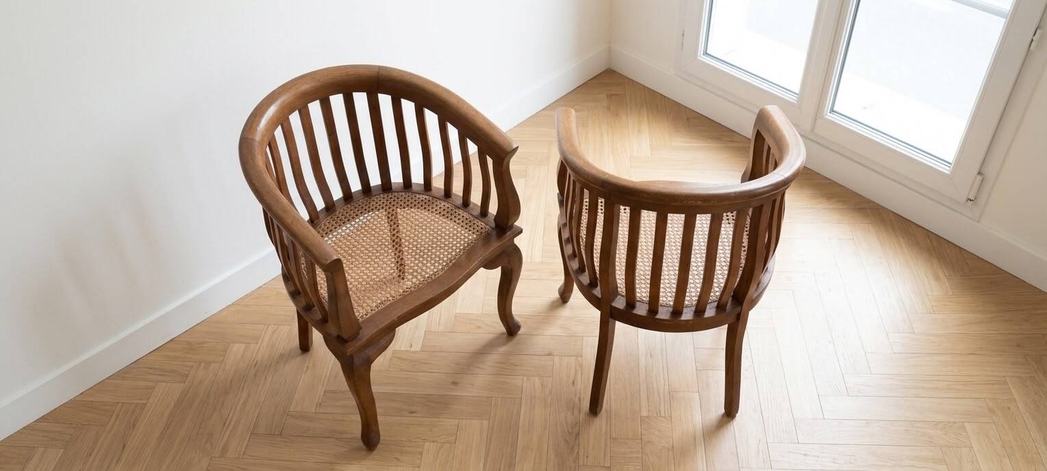 Pair of antique wooden and caned armchairs