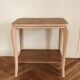 Side table with curved pink legs