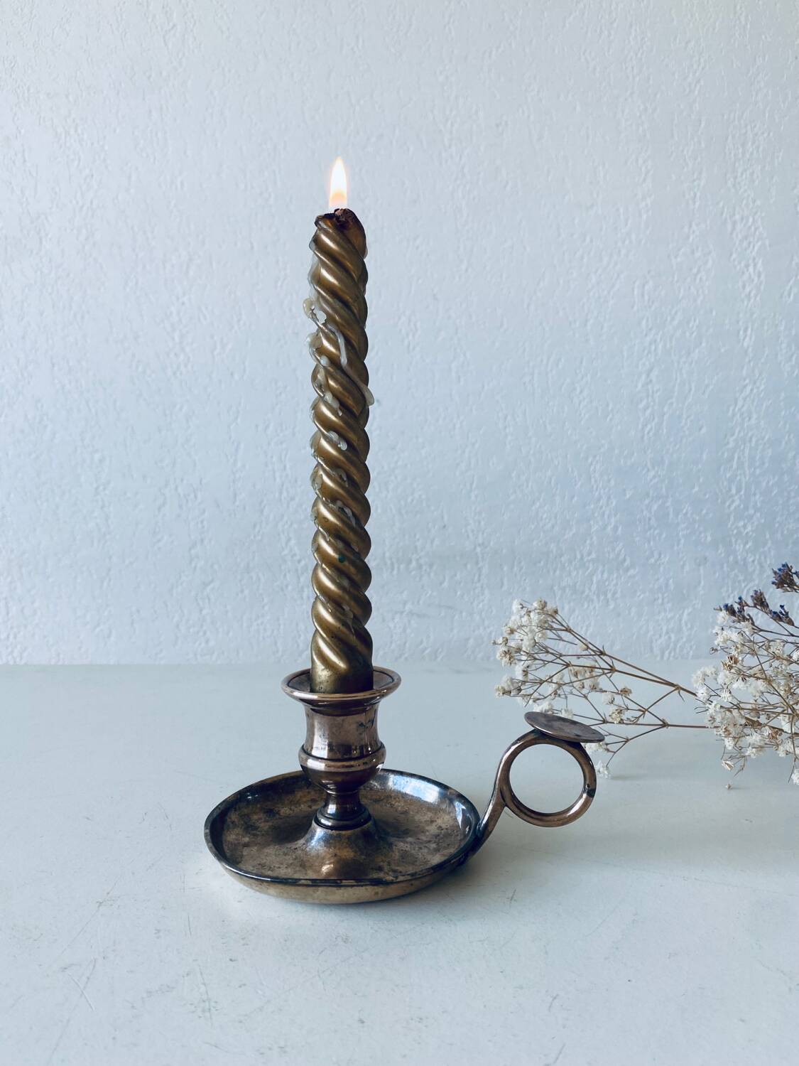 Brass thumbscrew candle holder