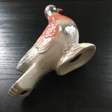 Antique bird in pearly ceramic