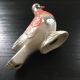 Antique bird in pearly ceramic