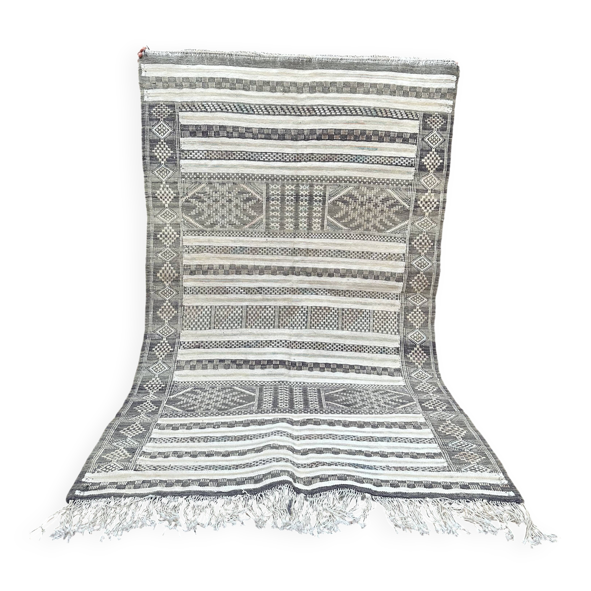 Handwoven Kilim rug made of camel wool, silk, and cactus.