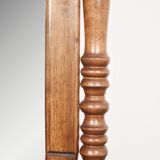 Large psychic mirror on legs with pivoting oval frame.