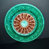 Antique plate in turquoise brown green slip with arabesque decoration