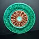 Antique plate in turquoise brown green slip with arabesque decoration