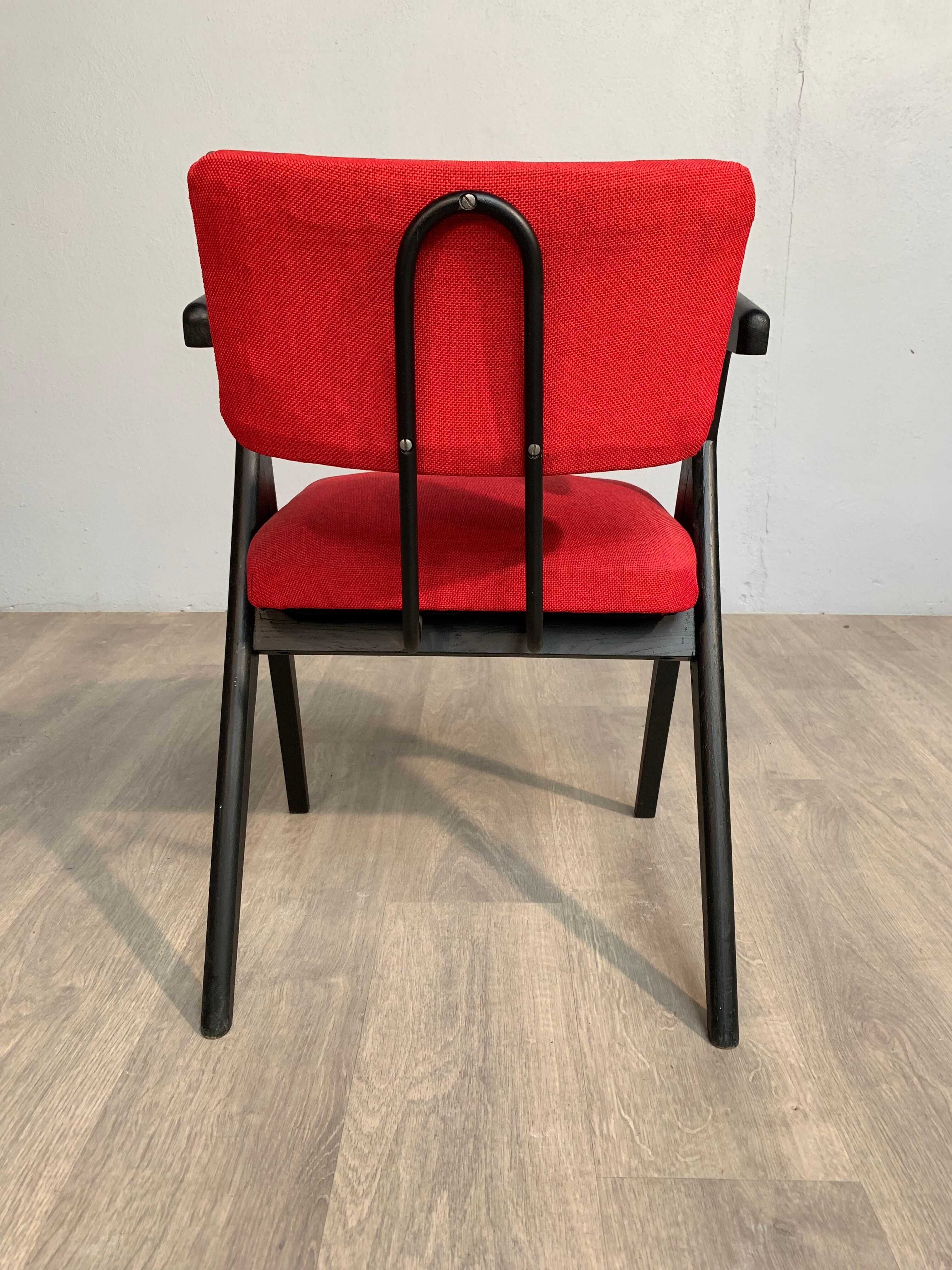 Red fabric chair with black base