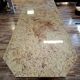 Large polished granite dining table on an oak and iron base.