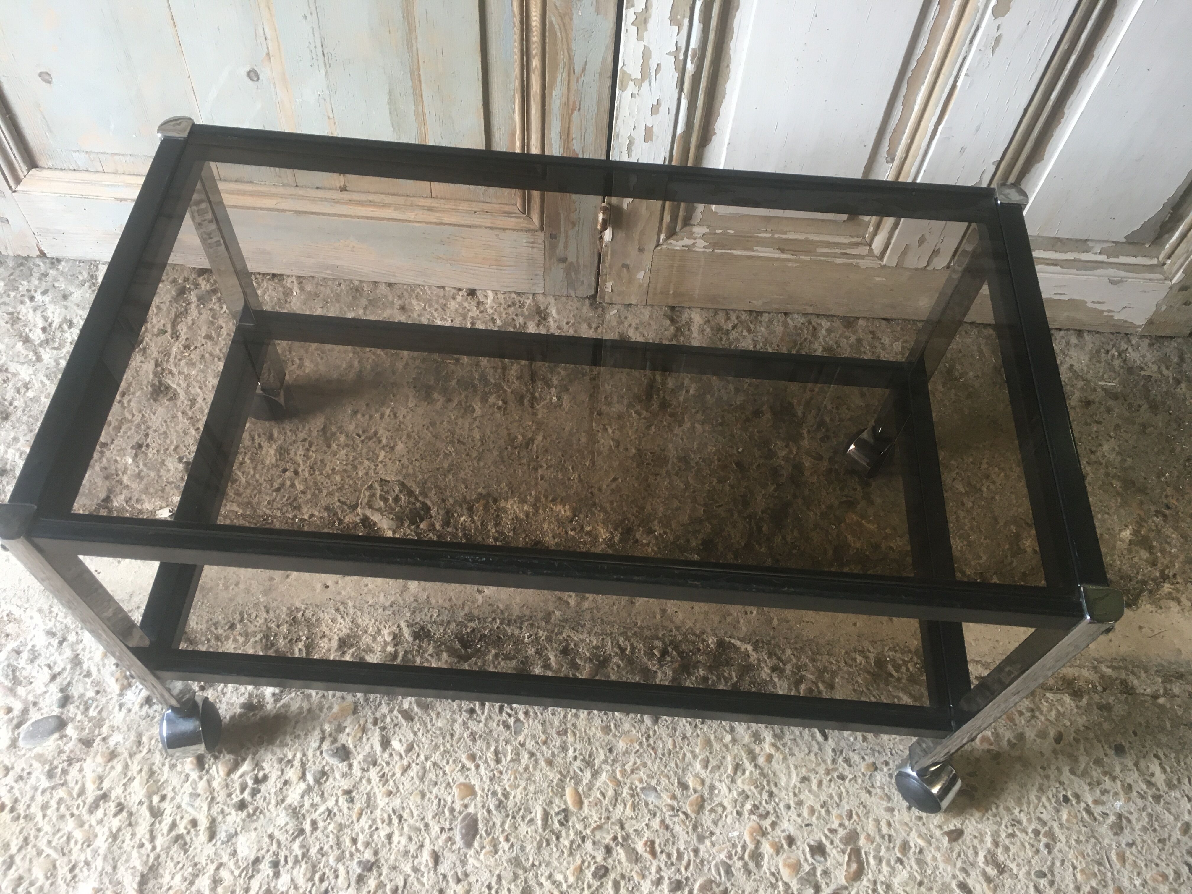 Metal coffee table with smoked glass.