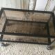 Metal coffee table with smoked glass.