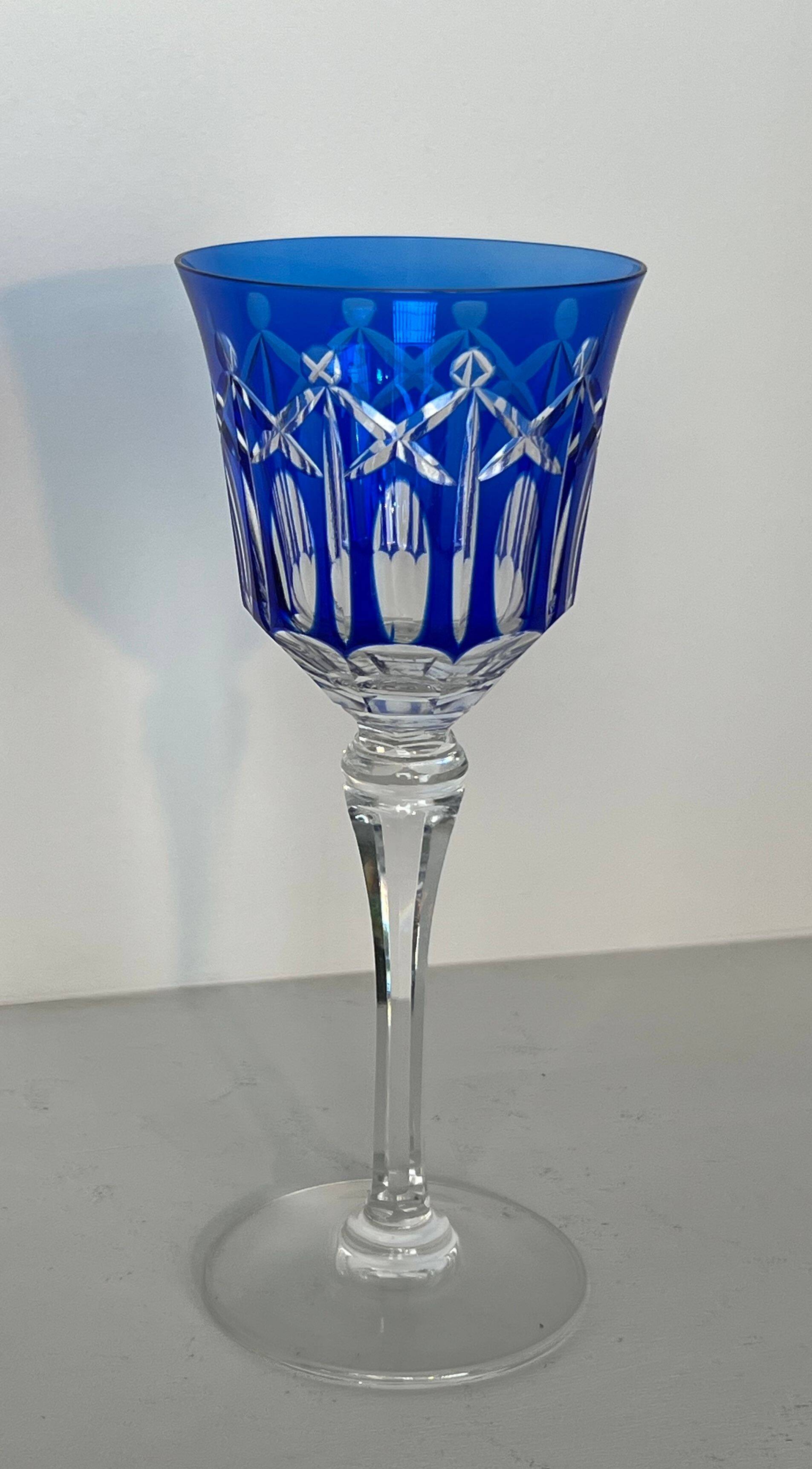 Set of twelve glasses in crystal tinted in different colours and cut with stars.
