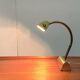 Mid-century brass swan neck table lamp in Hollywood Regency style from the 1960s.