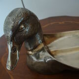 Empty pocketed old duck in solid brass