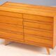 Vintage Czech chest of drawers U-453 by Jiří Jiroutek, 1960s, oak veneer, 110 × 45 × 77 cm