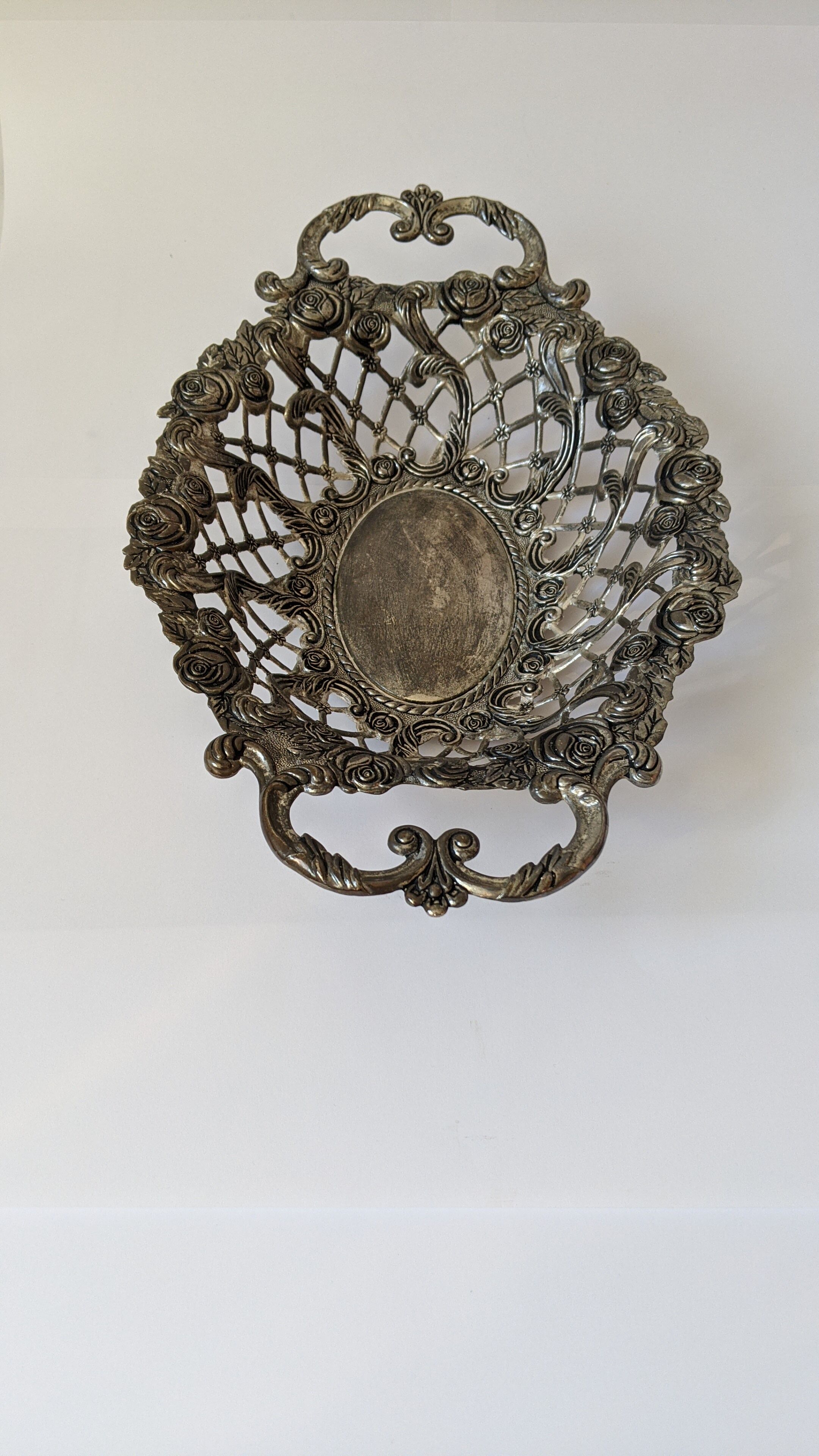 Beautiful silver metal basket with rose decoration