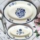 Mismatched antique flat plates accompanied by dishes.