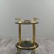 Rolling serving table in gold metal and smoked glass, 20th century