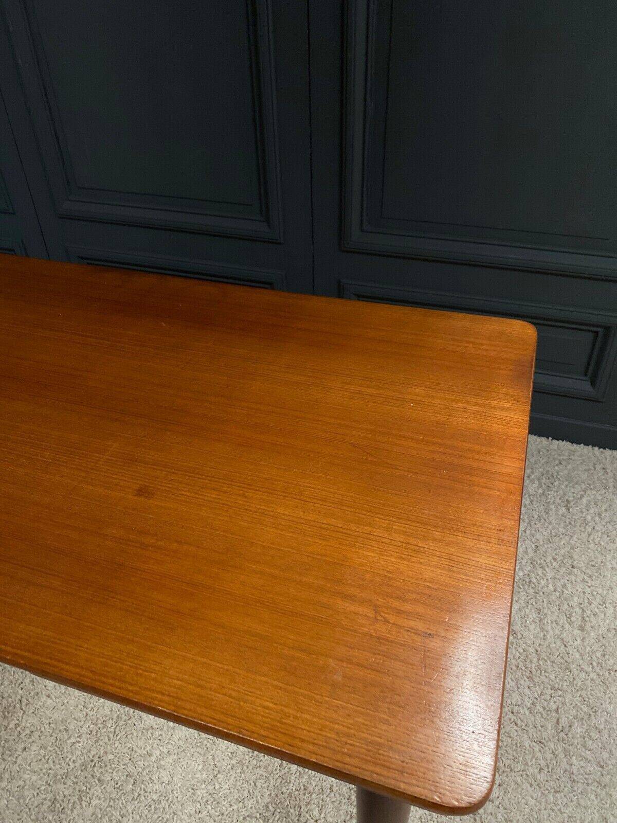 Scandinavian rectangular teak dining table with 4 tapered legs