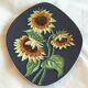 Decorative wall plate with sunflowers.