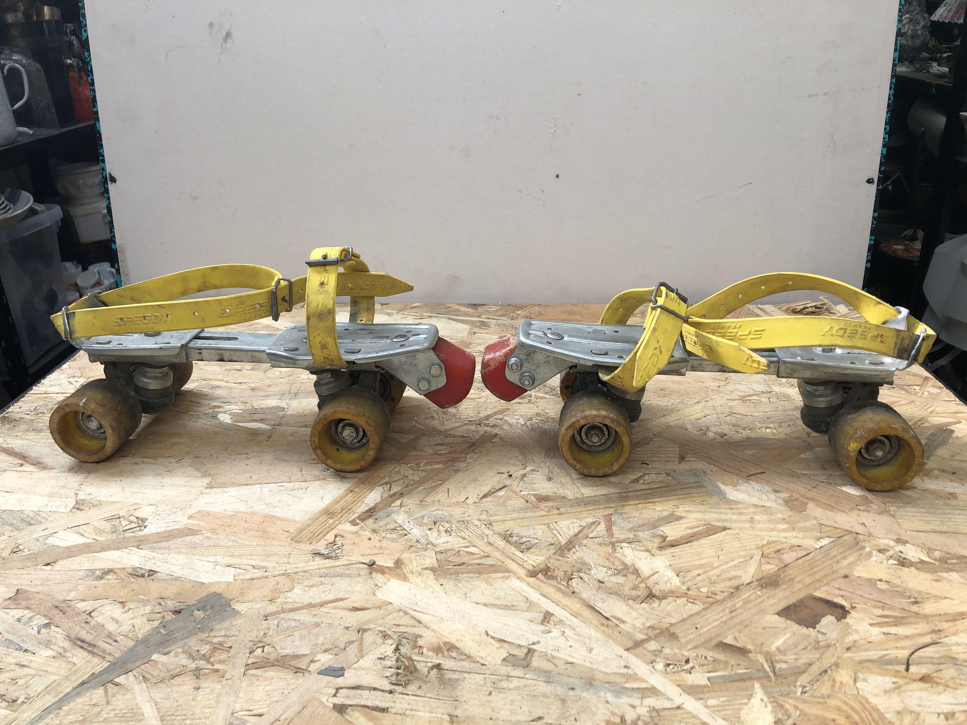 Old pair of speedy metal roller skates grey + straps & vintage brake