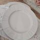 Set of 7 flat plates in white Limoges porcelain geometric decoration in relief