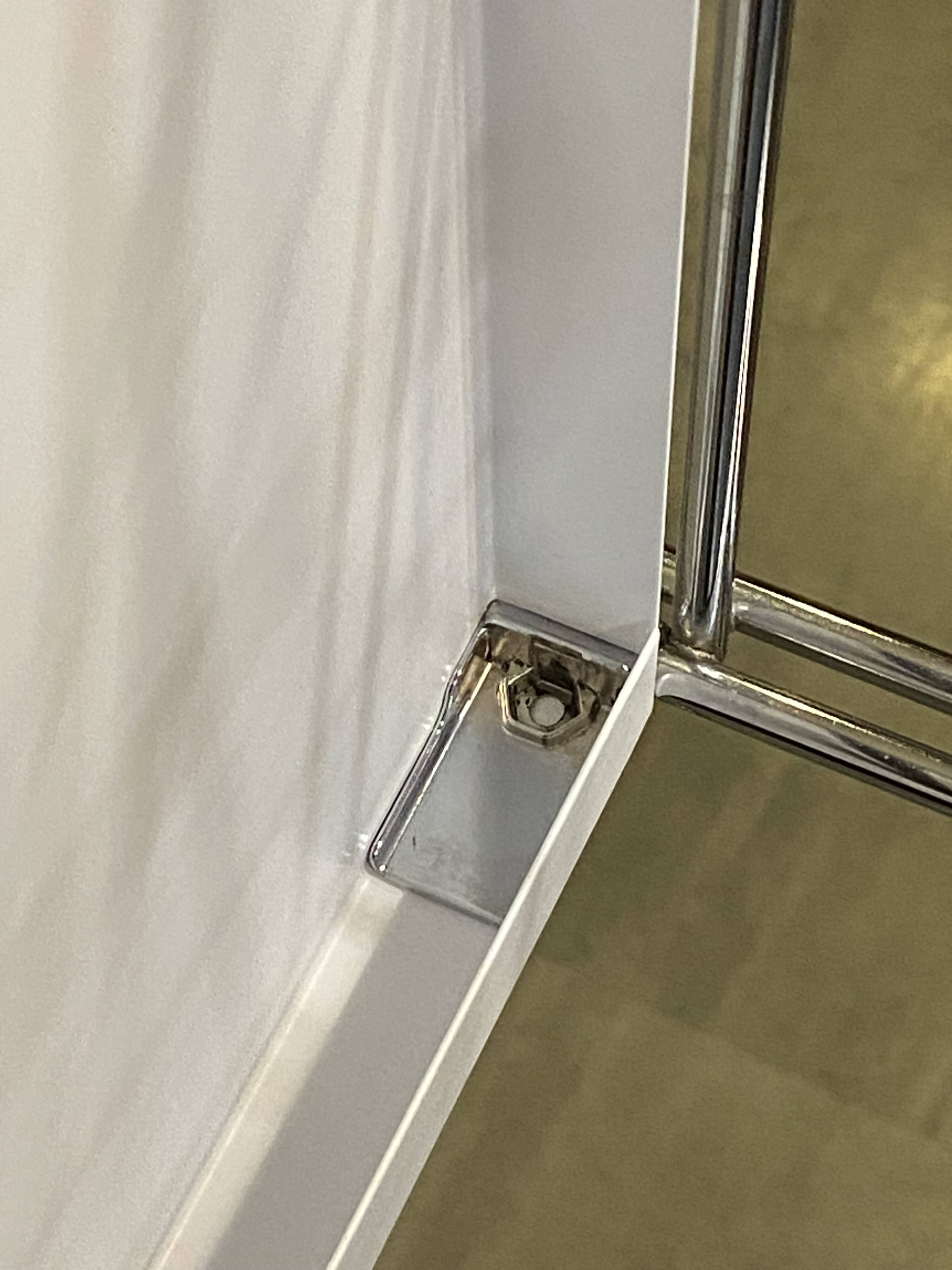 Modular wall bookshelf desk in vintage chrome.