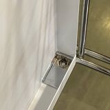 Modular wall bookshelf desk in vintage chrome.