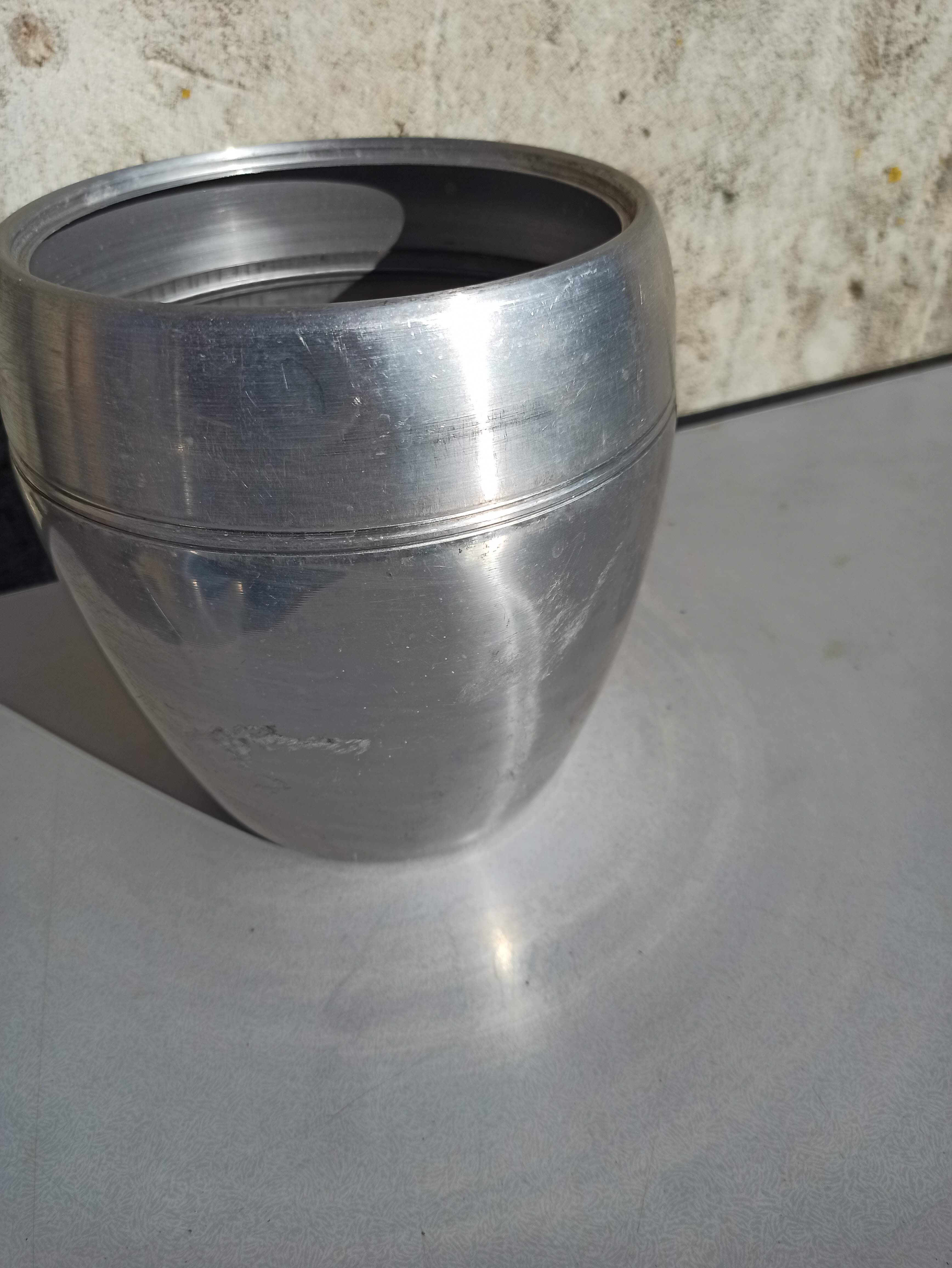 Old ice bucket ice cube in the shape of aluminum pear