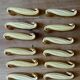 Set of 12 vintage art deco yellow and gold ceramic knife rests