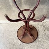 Pedestal table in curved wood