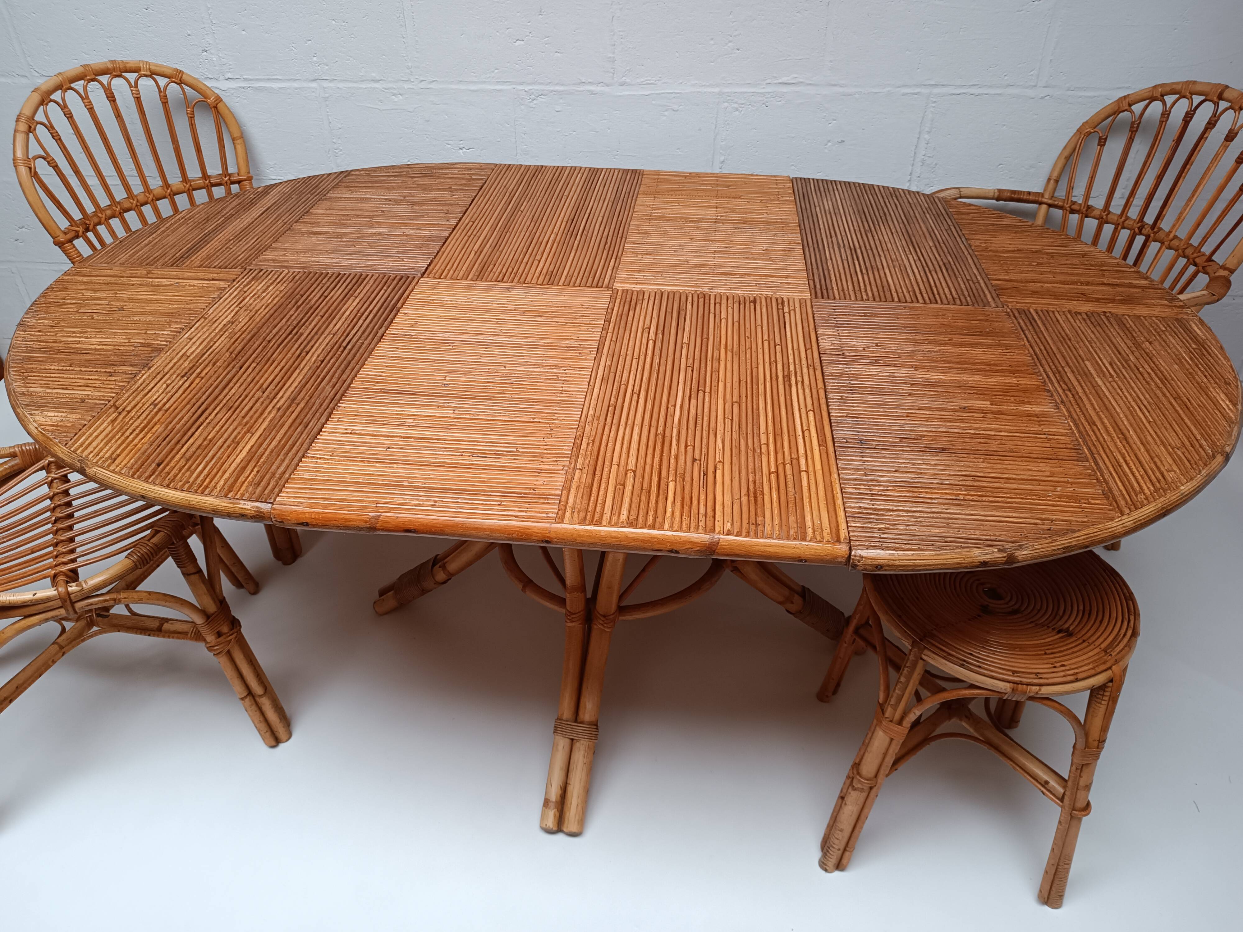 Bamboo table with extensions, 3 chairs and 3 stools from the 1960s.