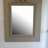 Wooden mirror with patinated beige knot