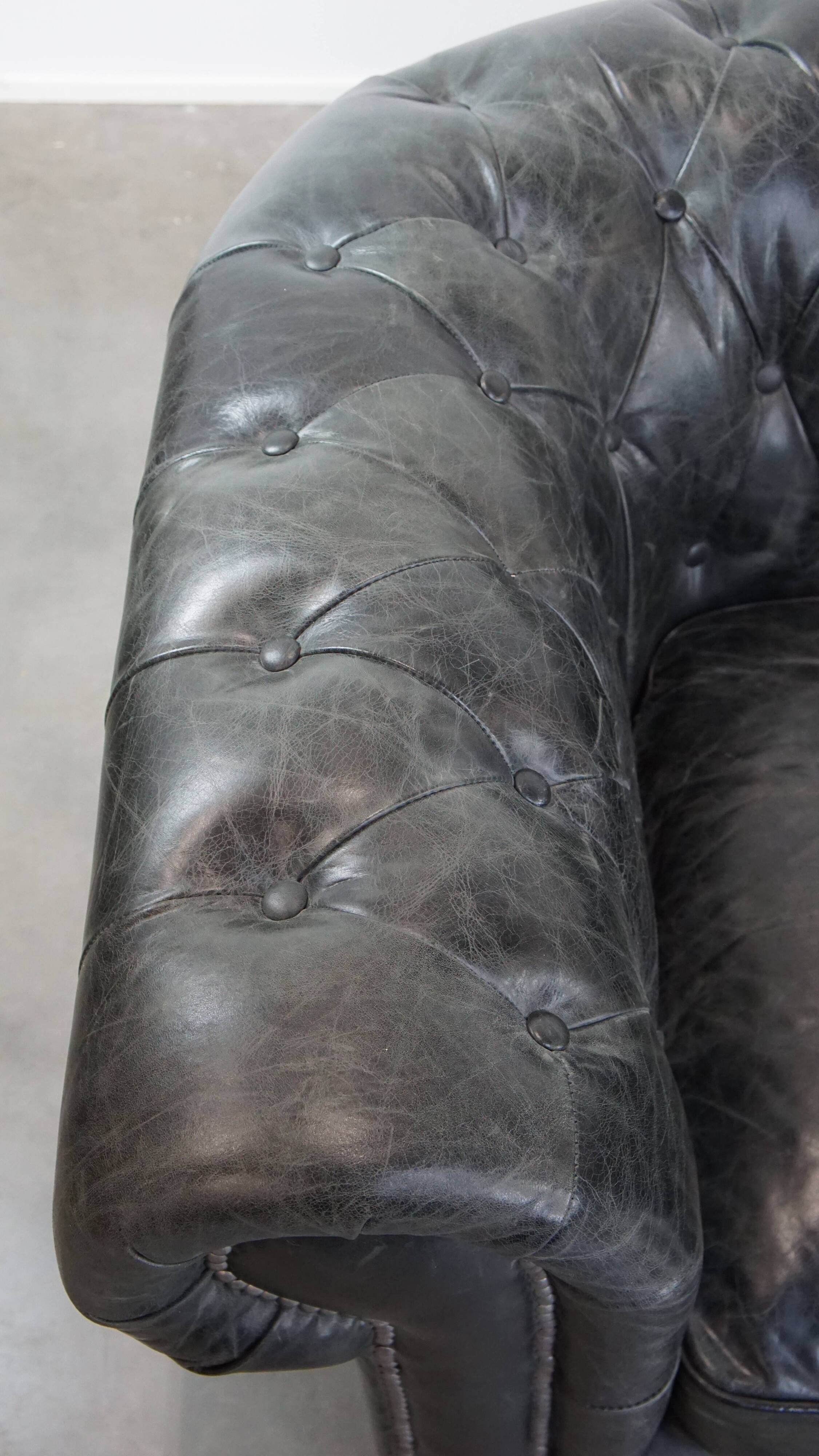 Set of 2 black Chesterfield armchairs in grained cowhide leather