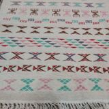 White carpet with multicolored Berber patterns handmade
