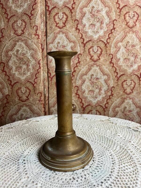 Patinated gilt brass candlestick