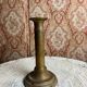Patinated gilt brass candlestick