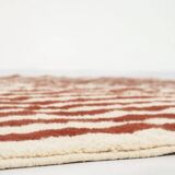 A handmade Moroccan striped terracotta rug, 150/250cm