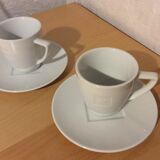 2 coffee cups and saucers
