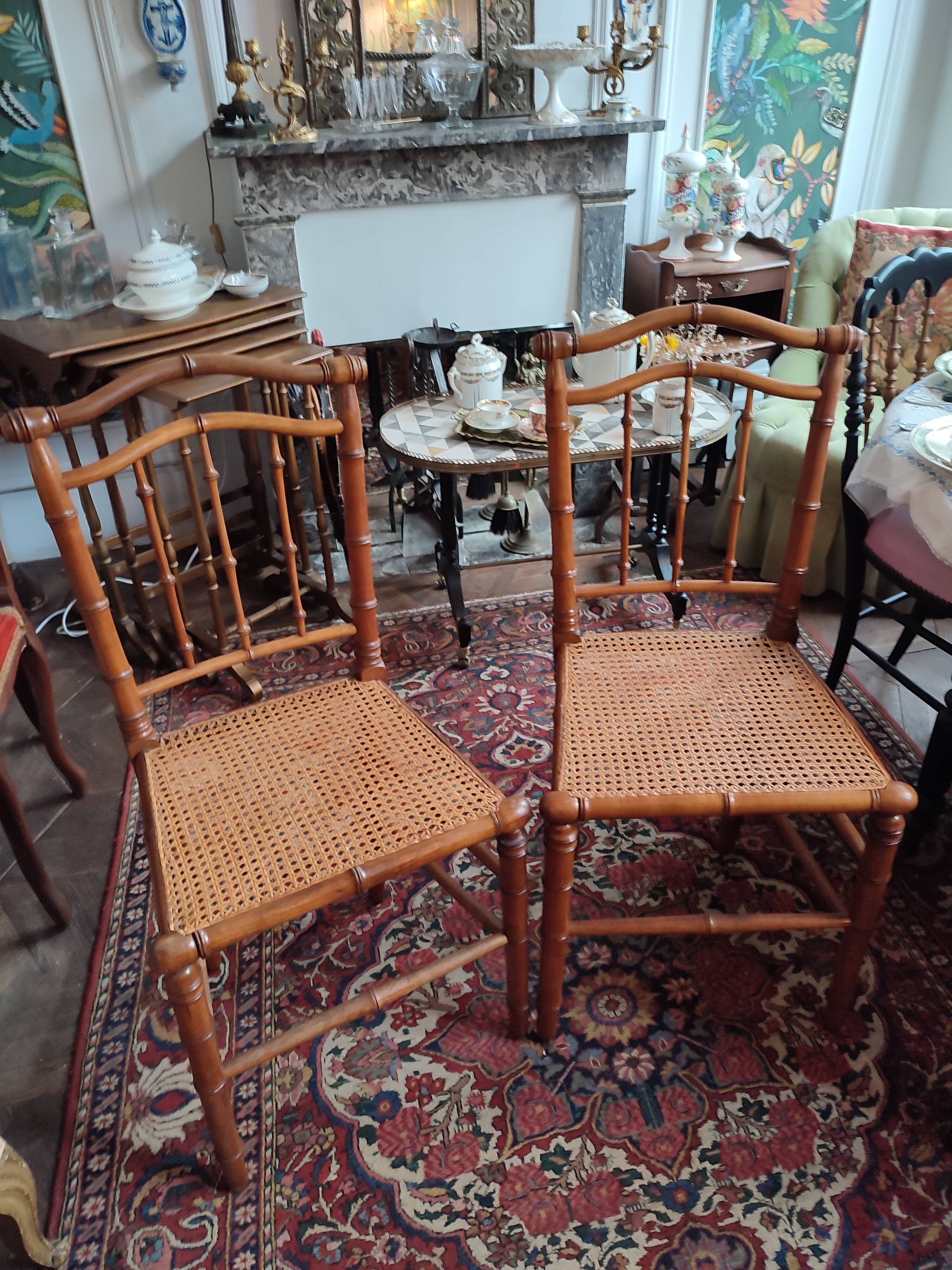 Pair of bamboo-style wooden canned chairs