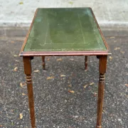 English Regency style coffee table in green leather with gilding and glass from the 1960s.