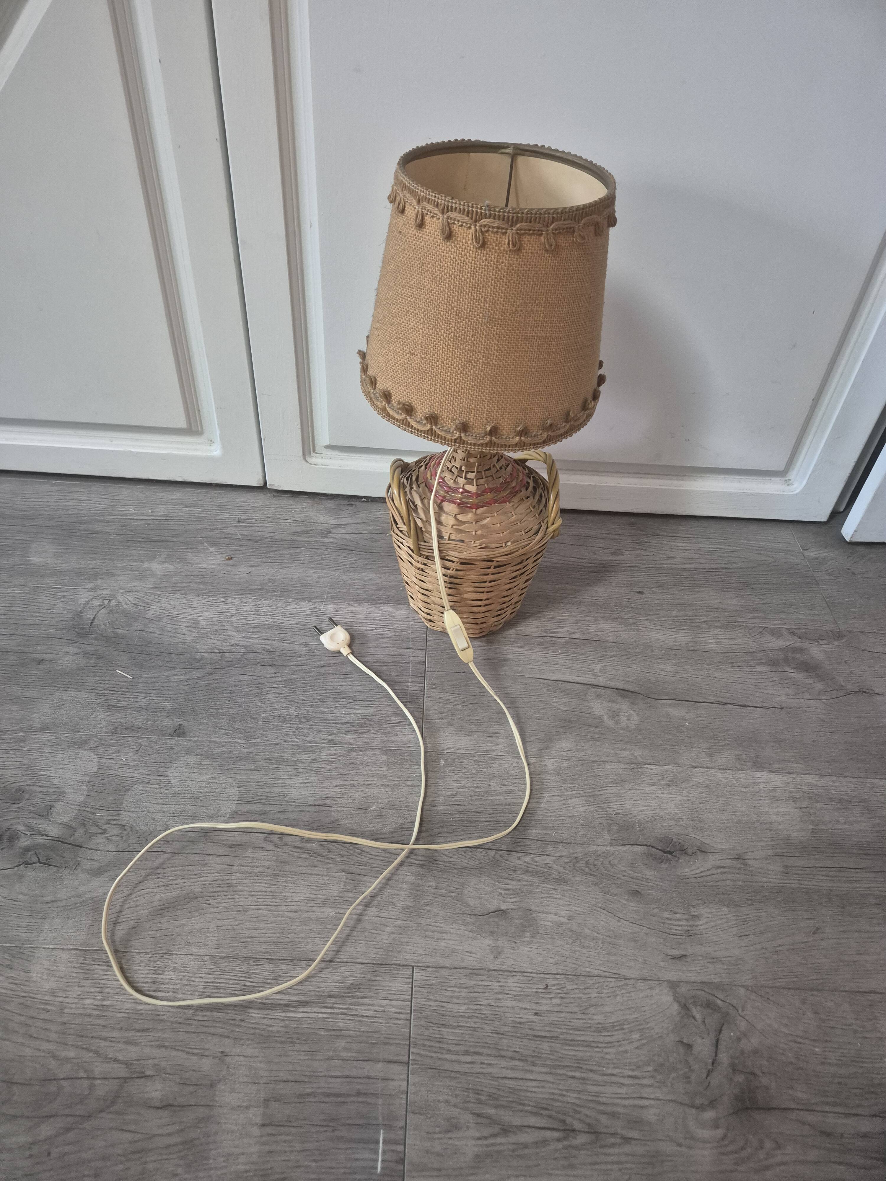 vintage table lamp dame jeanne covered in rattan wicker with a handle