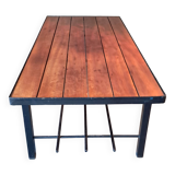 Vintage modernist coffee table in teak and black metal.
