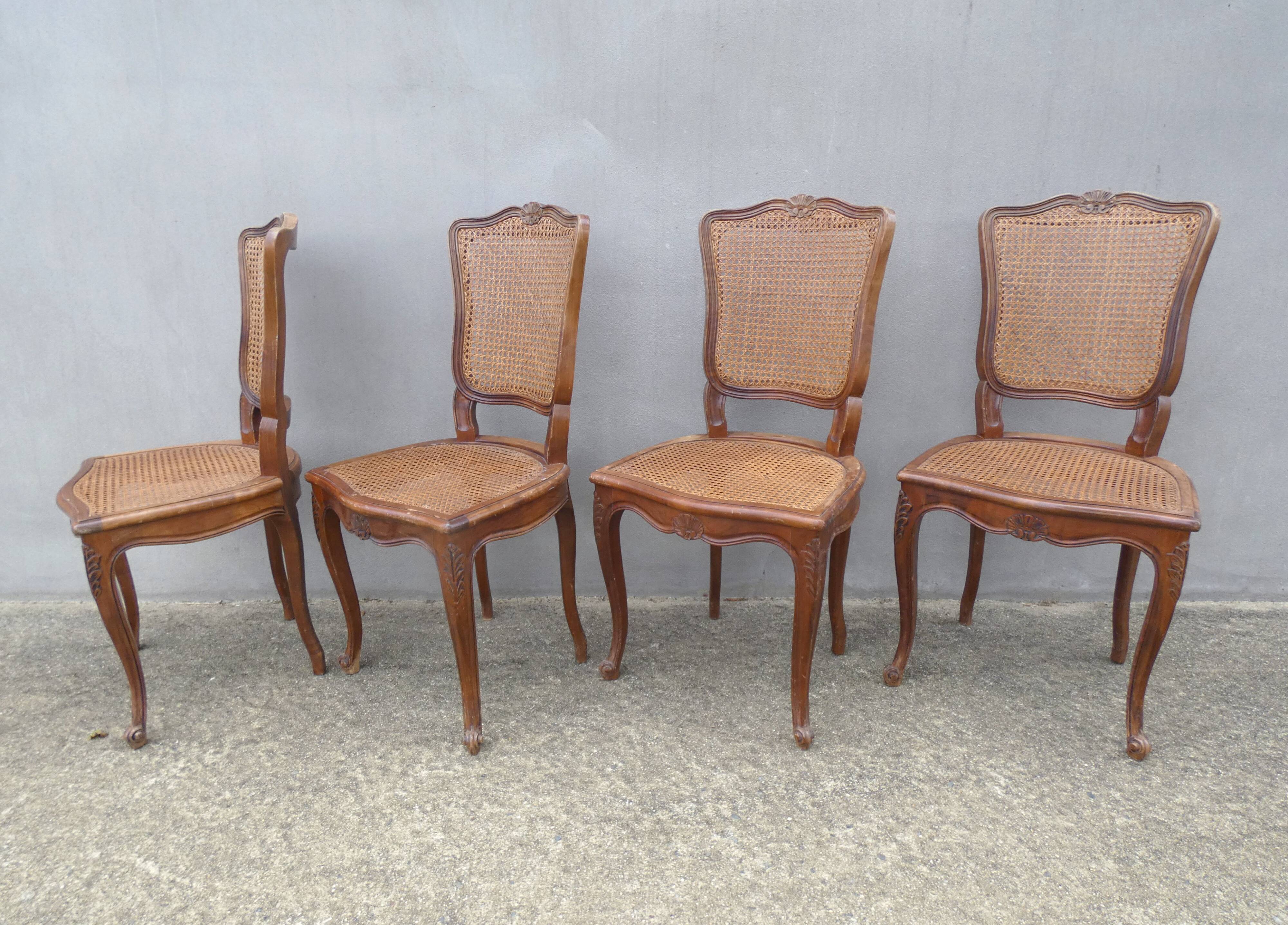 4 caned wooden chairs