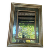 Miroir mercurisé en bois patiné doré