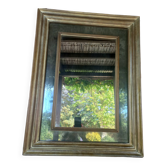 Miroir mercurisé en bois patiné doré