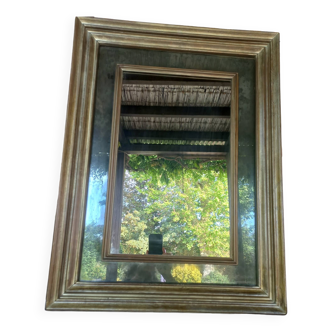 Miroir mercurisé en bois patiné doré