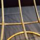 Tubular metal chair covered with gilding