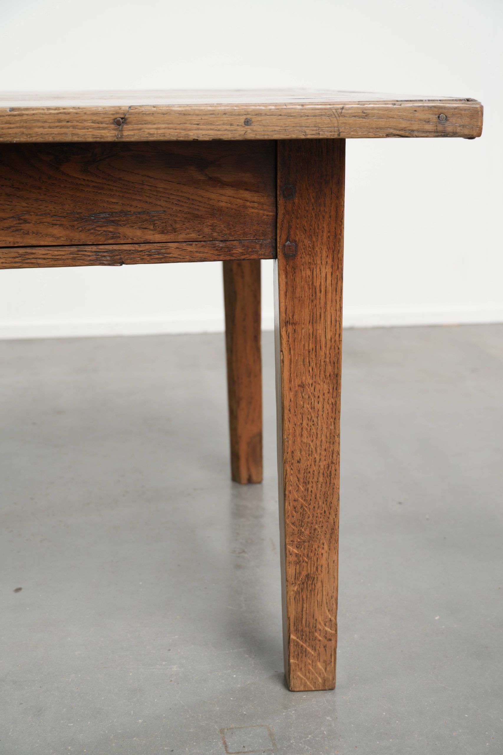 Antique pinewood coffee table with a drawer and a rural appearance