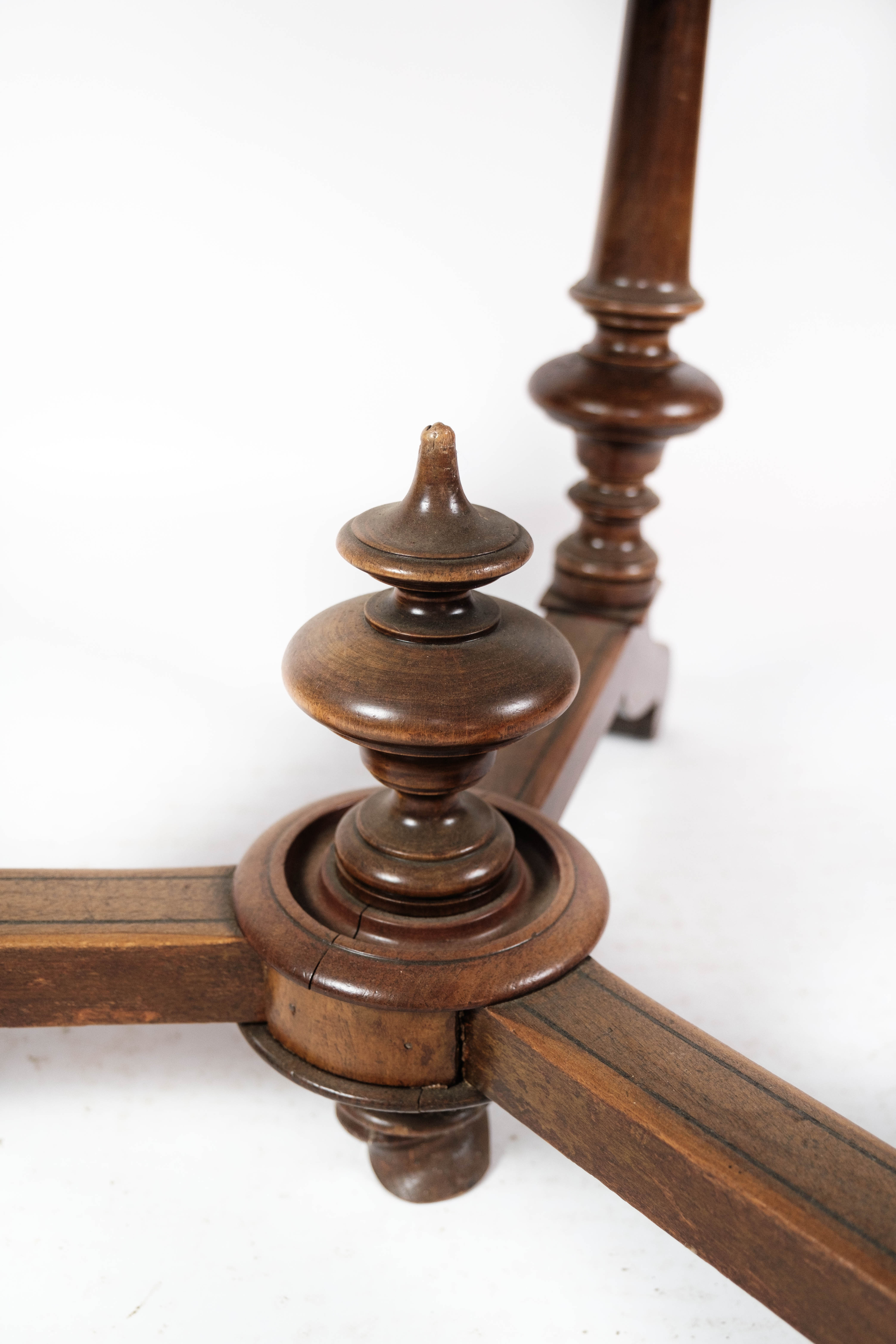 Round dining table of walnut with inlaid wood, 1890s