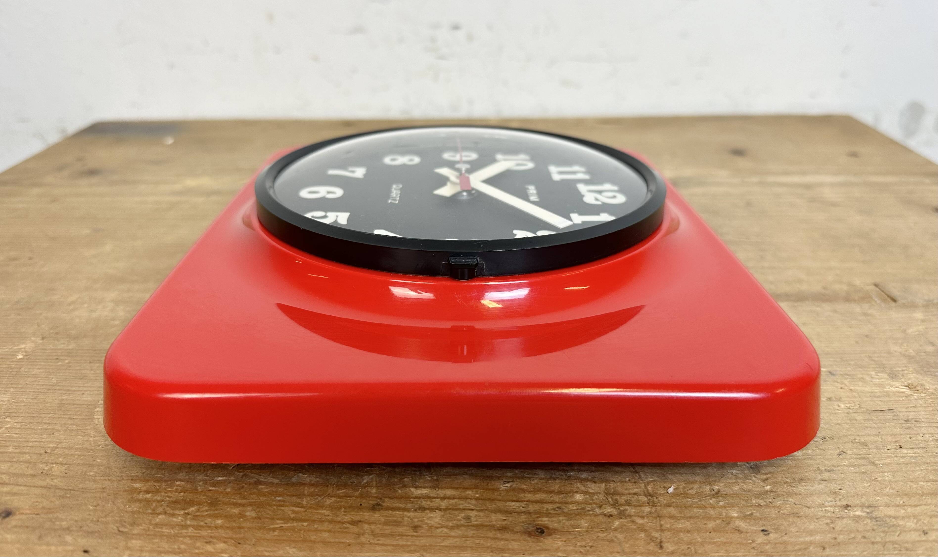 Vintage red bakelite wall clock from prim, 1970s
